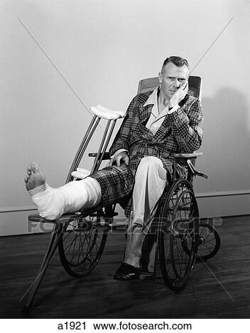 1950S Man In Wheelchair Leg In Cast Elevated Head In Hand Crutches At Side View Large Photo Image Stock Image - 1950S Man In Wheelchair Leg In Cast Elevated Head In Hand Crutches At Side . Fotosearch