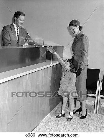 1950S Man Teller New Accounts In Bank Mother Woman With Little Girl Daughter Hands Passbook View Large Photo Image Stock Photograph - 1950S Man Teller New Accounts In Bank Mother Woman With Little Girl Daughter Hands Passbook . Fotosearch