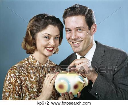 1950S Man & Woman Put Quarter In Piggy Bank View Large Photo Image Stock Image - 1950S Man & Woman Put Quarter In Piggy Bank . Fotosearch