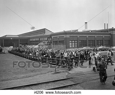 1950S Mass Of Factory Workers Leaving Building After Work View Large Photo Image Stock Photograph - 1950S Mass Of Factory Workers Leaving Building After Work . Fotosearch