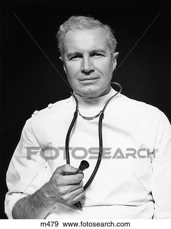 1950S Medical Doctor Holding Tip Of Stethoscope In Right Hand View Large Photo Image Stock Photo - 1950S Medical Doctor Holding Tip Of Stethoscope In Right Hand. Fotosearch