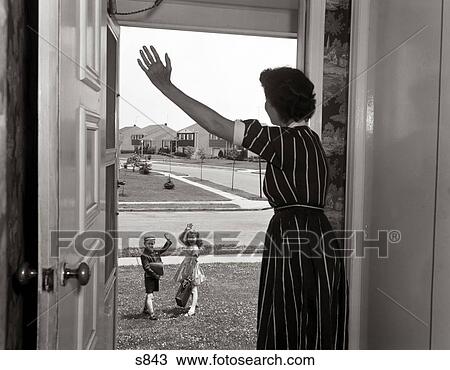 1950S Mom In Doorway Waving At Boy & Girl Going To School View Large Photo Image Stock Image - 1950S Mom In Doorway Waving At Boy & Girl Going To School . Fotosearch