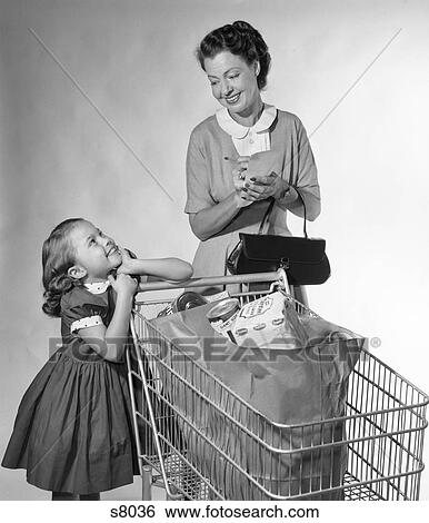 1950S Mother Daughter With Grocery Bags In Shopping Cart Mother Checking Off List Girl Smiling View Large Photo Image Stock Photograph - 1950S Mother Daughter With Grocery Bags In Shopping Cart Mother Checking Off List Girl Smiling . Fotosearch