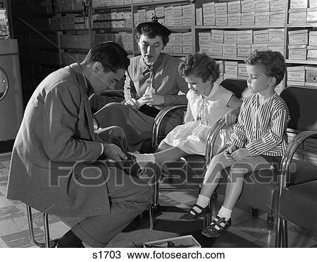 1950S Mother Son Daughter In Shoe Store Salesman Sizing Shoes On Little Girl Shop Retail Shelves With Shoe Boxes View Large Photo Image Stock Image - 1950S Mother Son Daughter In Shoe Store Salesman Sizing Shoes On Little Girl Shop Retail Shelves With Shoe Boxes . Fotosearch