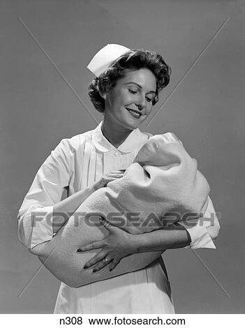 1950S Nurse Holding Newborn Infant Wrapped In Blanket View Large Photo Image Stock Photo - 1950S Nurse Holding Newborn Infant Wrapped In Blanket . Fotosearch