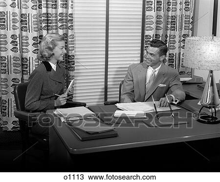 1950S Office Man Woman Businessman At Desk Smiling At Secretary Ready To Take Dictation View Large Photo Image Stock Image - 1950S Office Man Woman Businessman At Desk Smiling At Secretary Ready To Take Dictation . Fotosearch
