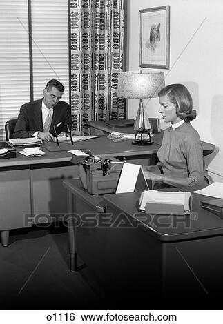 Stock Photograph - 1950S Office With Executive At Desk And Secretary Typing . Fotosearch