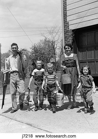 1950S Portrait Family With Gardening Tools View Large Photo Image Stock Photo - 1950S Portrait Family With Gardening Tools . Fotosearch