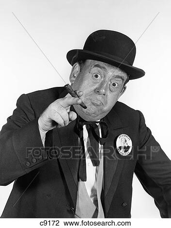 Stock Image - 1950S Portrait Man In Old-Time Politician Costume Pointing Toward Camera With Cigar In Hand . Fotosearch