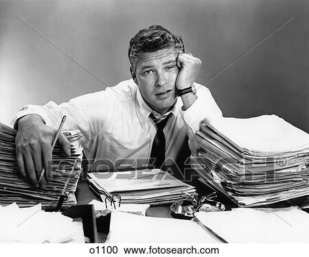 1950S Portrait Man Overworked With Desk Full Of Papers View Large Photo Image Stock Image - 1950S Portrait Man Overworked With Desk Full Of Papers . Fotosearch