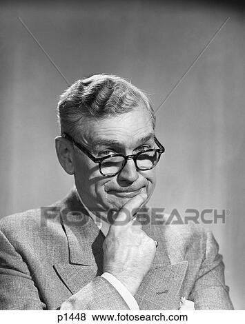 Stock Photo - 1950S Portrait Middle-Aged Older Man Wearing Eyeglasses Finger On Chin Look Forward Funny . Fotosearch