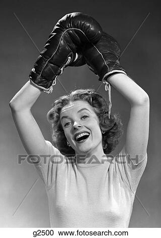 1950S Portrait Of Woman Wearing Boxing Gloves In Winning Pose Raised Overhead View Large Photo Image Stock Image - 1950S Portrait Of Woman Wearing Boxing Gloves In Winning Pose Raised Overhead . Fotosearch
