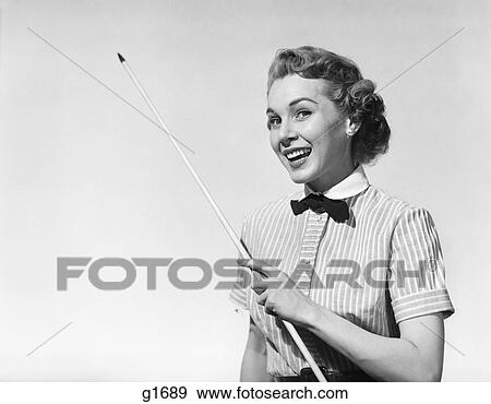 1950S Portrait Woman Smiling Holding Pointer View Large Photo Image Stock Photo - 1950S Portrait Woman Smiling Holding Pointer . Fotosearch