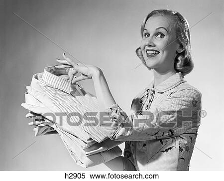 1950S Proud Smiling Woman Housewife Holding Freshly Laundered Mens Shirts View Large Photo Image Stock Photography - 1950S Proud Smiling Woman Housewife Holding Freshly Laundered Mens Shirts . Fotosearch