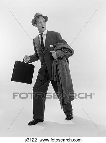 1950S Salesman Man Holding Briefcase & Coat Over Arm Taking A Step Forward & Looking Back View Large Photo Image Stock Image - 1950S Salesman Man Holding Briefcase & Coat Over Arm Taking A Step Forward & Looking Back . Fotosearch