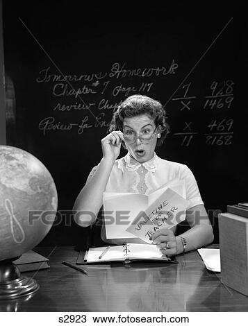 1950S School Teacher At Desk Hand To Glasses Expression Of Surprise Opening A Valentine For Teacher Globe Blackboard View Large Photo Image Stock Image - 1950S School Teacher At Desk Hand To Glasses Expression Of Surprise Opening A Valentine For Teacher Globe Blackboard . Fotosearch
