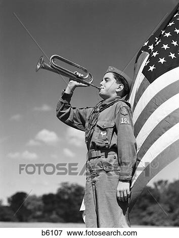 1950S Side View Of Boy Scout Standing In Front Of American Flag Bugling View Large Photo Image Stock Photo - 1950S Side View Of Boy Scout Standing In Front Of American Flag Bugling . Fotosearch