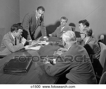 1950S Six Businessmen Executives Around A Conference Table Talking View Large Photo Image Stock Image - 1950S Six Businessmen Executives Around A Conference Table Talking. Fotosearch