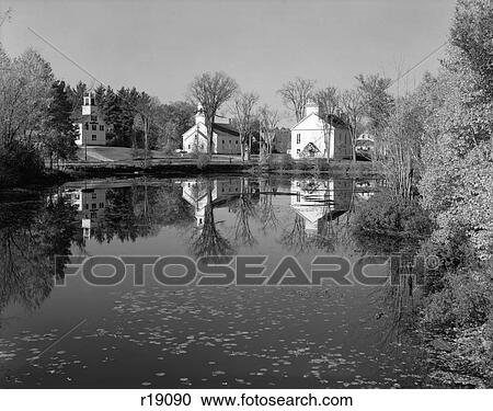 Stock Image - 1950S Smalltown White Public Buildings Around Lake Spring Church School Town Hall . Fotosearch