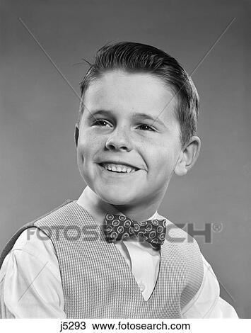 1950S Smiling Boy Portrait Wearing Checked Vest Polka Dot Bow Tie School Picture View Large Photo Image Stock Image - 1950S Smiling Boy Portrait Wearing Checked Vest Polka Dot Bow Tie School Picture . Fotosearch