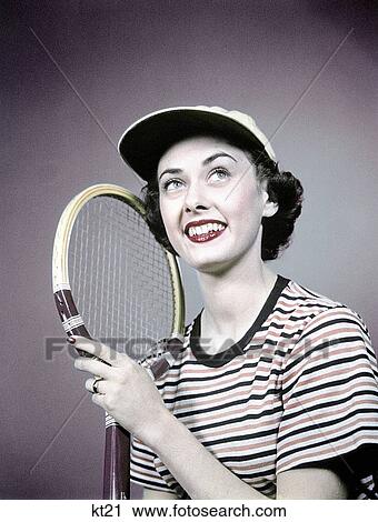 1950S Smiling Brunette Woman Holding Tennis Racket Wear Striped Shirt Cap View Large Photo Image Stock Image - 1950S Smiling Brunette Woman Holding Tennis Racket Wear Striped Shirt Cap . Fotosearch