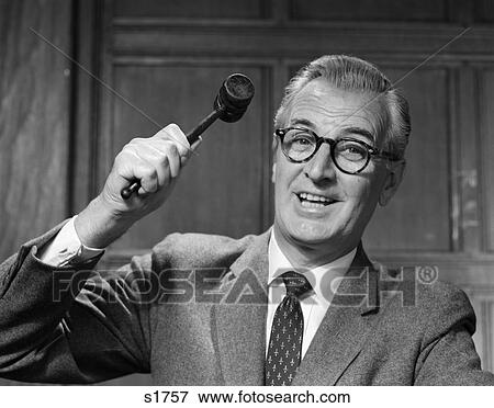 1950S Smiling Man Glasses Holding Gavel Arm Raised Poised To Strike Decision Order Court Or Auctioneer Going Going Gone View Large Photo Image Stock Photo - 1950S Smiling Man Glasses Holding Gavel Arm Raised Poised To Strike Decision Order Court Or Auctioneer Going Going Gone. Fotosearch