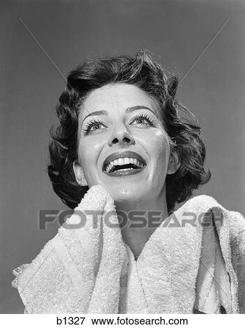 Stock Photo - 1950S Smiling Woman Drying Face With Towel . Fotosearch