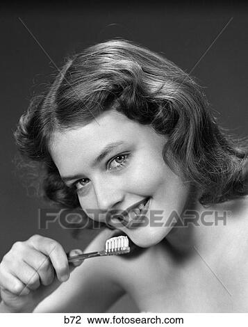 1950S Smiling Woman Holding Tooth Brush View Large Photo Image Stock Image - 1950S Smiling Woman Holding Tooth Brush . Fotosearch