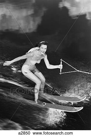1950S Smiling Woman In A Bathing Suit Water Skiing Spray Towline Speed Exhilaration View Large Photo Image Stock Image - 1950S Smiling Woman In A Bathing Suit Water Skiing Spray Towline Speed Exhilaration . Fotosearch