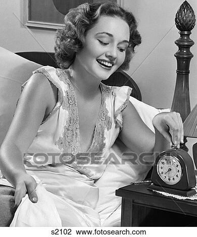 1950S Smiling Woman In Bed Setting Alarm Clock View Large Photo Image Stock Image - 1950S Smiling Woman In Bed Setting Alarm Clock . Fotosearch