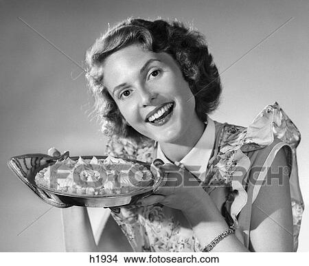 1950S Smiling Woman Presenting Holding Freshly Baked Pie View Large Photo Image Picture - 1950S Smiling Woman Presenting Holding Freshly Baked Pie . Fotosearch