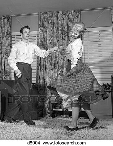 1950S Teen Couple Doing The Jitterbug In Livingroom View Large Photo Image Picture - 1950S Teen Couple Doing The Jitterbug In Livingroom . Fotosearch