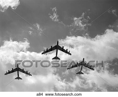 1950S Three B. 52 Bombers In Flight Formation As Seen From The Ground Directly Over Head Clouds Silhouettes Sky View Large Photo Image Picture - 1950S Three B. 52 Bombers In Flight Formation As Seen From The Ground Directly Over Head Clouds Silhouettes Sky. Fotosearch