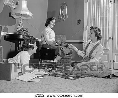 1950S Three Teen Girls Talking Listening To Music Playing 45Rpm Records Portable Phonograph Record Player View Large Photo Image Stock Image - 1950S Three Teen Girls Talking Listening To Music Playing 45Rpm Records Portable Phonograph Record Player . Fotosearch