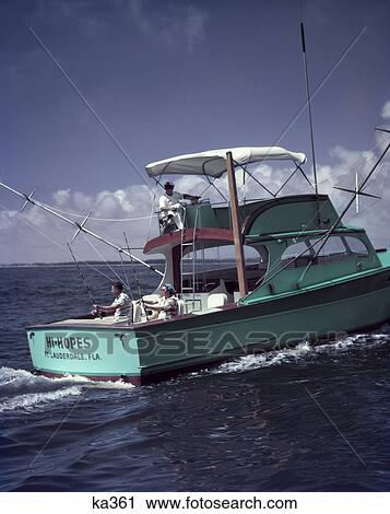 1950S Turquoise Green Fishing Boat On Water Man Woman Fishing Off Stern Man At Helm Bimini Cover Ft. Lauderdale Fl View Large Photo Image Stock Image - 1950S Turquoise Green Fishing Boat On Water Man Woman Fishing Off Stern Man At Helm Bimini Cover Ft. Lauderdale Fl. Fotosearch