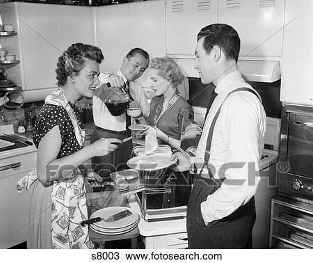 1950S Two Couples In Kitchen Man Pouring Coffee Woman Serving Ham Eggs From Toaster Oven Weekend Guests Morning Hospitality View Large Photo Image Stock Image - 1950S Two Couples In Kitchen Man Pouring Coffee Woman Serving Ham Eggs From Toaster Oven Weekend Guests Morning Hospitality. Fotosearch