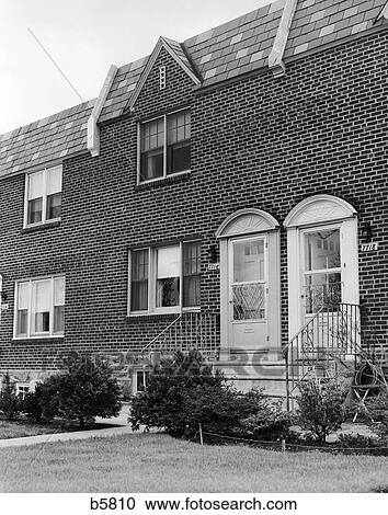 1950s Two Front Doors Of Attached Brick Row Houses With Front