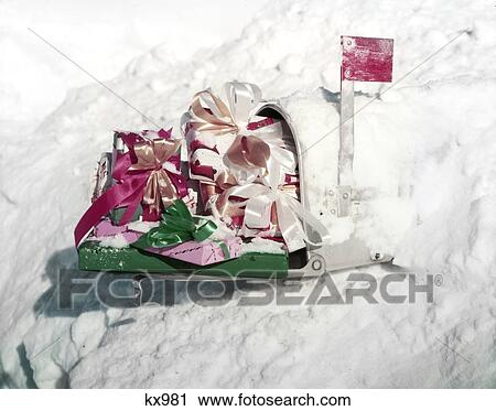 1950S White Rural Mail Box Sticking Out Of Snow Bank Red Flag Up Presents Bows Wrapping Paper Gifts Buried Winter View Large Photo Image Stock Image - 1950S White Rural Mail Box Sticking Out Of Snow Bank Red Flag Up Presents Bows Wrapping Paper Gifts Buried Winter. Fotosearch