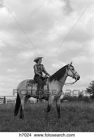 Picture - 1950S Woman Cowgirl On Horse At Ranch Smiling Profile Outdoor . Fotosearch