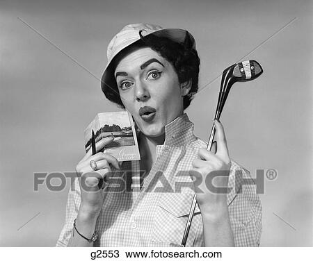 1950S Woman Holding Golf Club Driver And Score Card & Pencil In Other Hand Par Worried Expression Wearing Hat And Checked Blouse View Large Photo Image Stock Image - 1950S Woman Holding Golf Club Driver And Score Card & Pencil In Other Hand Par Worried Expression Wearing Hat And Checked Blouse. Fotosearch
