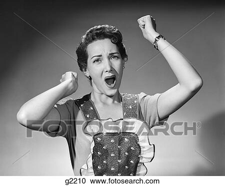 1950S Woman In Apron Ruffled Edge Fists Up In Air Yelling Screaming Angry Housewife Expression Complain Nag Darn View Large Photo Image Stock Image - 1950S Woman In Apron Ruffled Edge Fists Up In Air Yelling Screaming Angry Housewife Expression Complain Nag Darn. Fotosearch