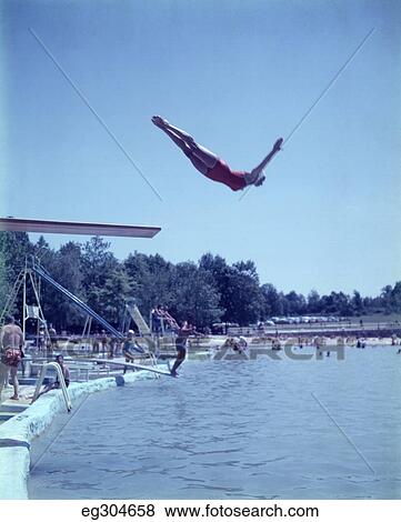 1950S Woman Mid-Air Diving Into Public Swimming Pool View Large Photo Image Stock Photo - 1950S Woman Mid-Air Diving Into Public Swimming Pool. Fotosearch