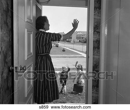 1950S Woman Mother Waving From Doorway As Boy Girl Leave For School In Morning View Large Photo Image Stock Photo - 1950S Woman Mother Waving From Doorway As Boy Girl Leave For School In Morning . Fotosearch