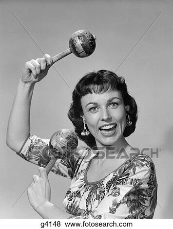 1950S Woman Portrait Playing Maracas View Large Photo Image Stock Photo - 1950S Woman Portrait Playing Maracas . Fotosearch
