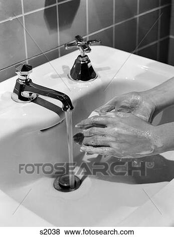 1950S Woman'S Hands Lathering Up With Bar Of Soap Under Bathroom Faucet View Large Photo Image Stock Photo - 1950S Woman'S Hands Lathering Up With Bar Of Soap Under Bathroom Faucet . Fotosearch