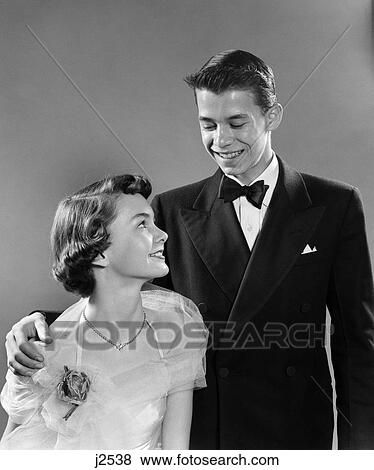 Stock Photo - 1950S Young Teen Couple Boy Girl Dressed In Formal Attire For High School Prom . Fotosearch
