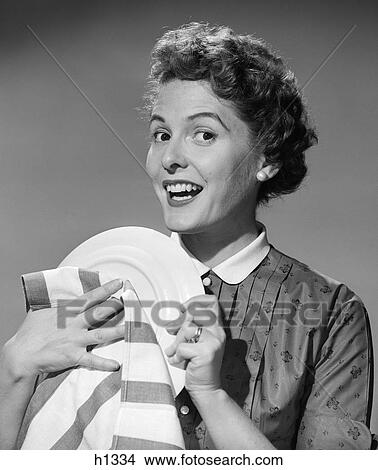 Picture - 195Os Woman Smiling Drying Plate With Stripe Dish Towel . Fotosearch