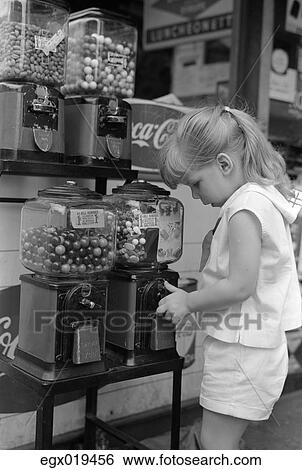 1960S Blond Girl With Ponytail At Gumball Penny Candy Machine View Large Photo Image Stock Photograph - 1960S Blond Girl With Ponytail At Gumball Penny Candy Machine. Fotosearch