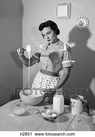1960S Housewife Mixing Sticky Batter In Kitchen View Large Photo Image Stock Image - 1960S Housewife Mixing Sticky Batter In Kitchen . Fotosearch