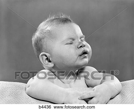 Baby With Eyes Closed And Mouth Pursed The Overall Effect Is A Fround Inside In The 1950S View Large Photo Image Stock Photograph - Baby With Eyes Closed And Mouth Pursed The Overall Effect Is A Fround Inside In The 1950S . Fotosearch